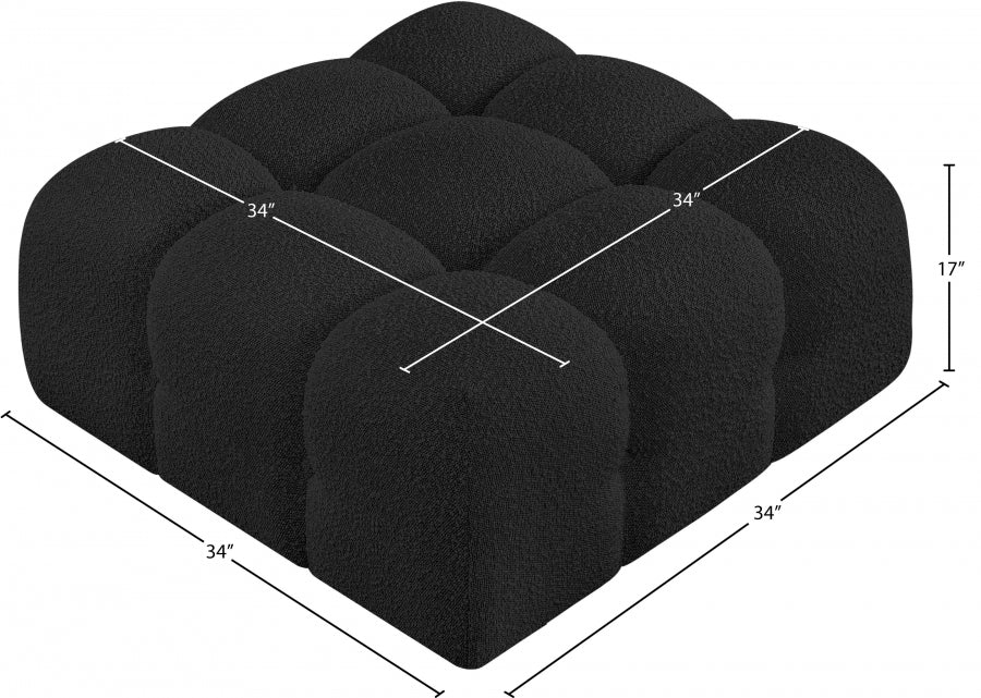 Pouf Ames en tissu bouclé